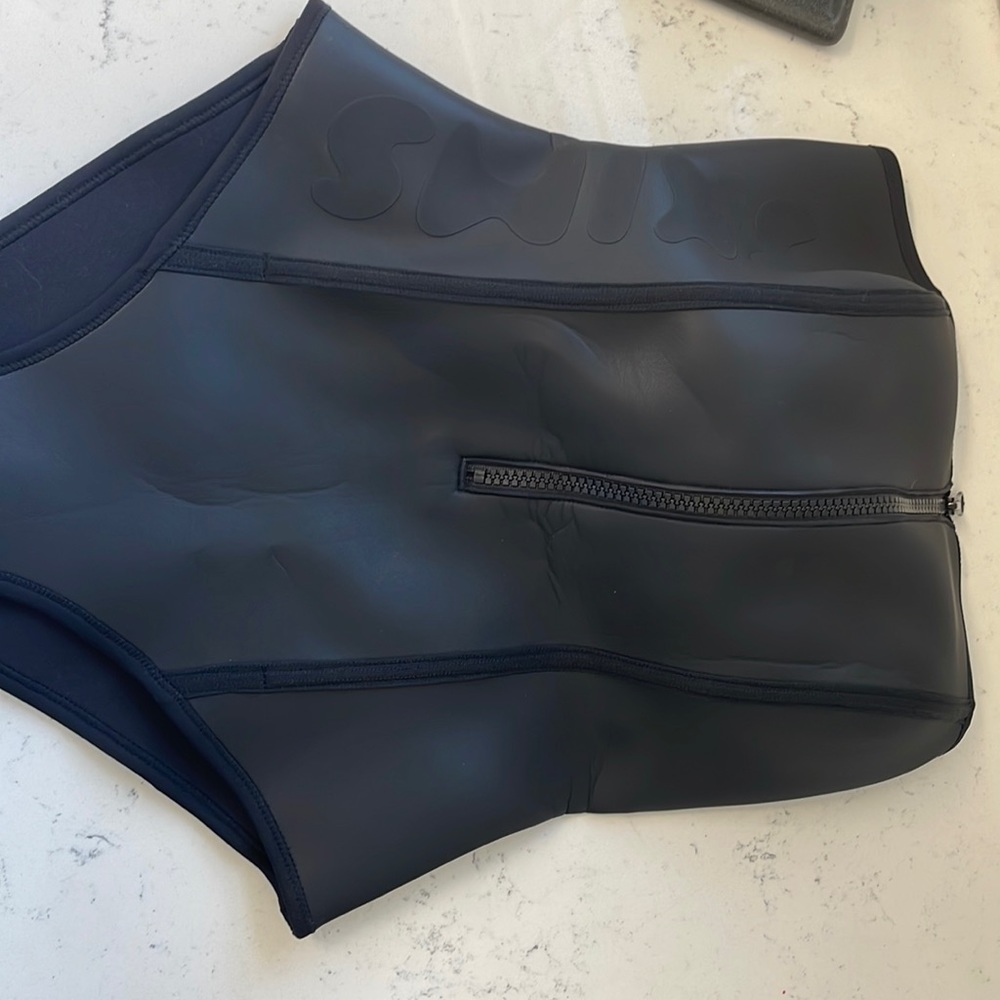 Strapless skims rubberized swimsuit